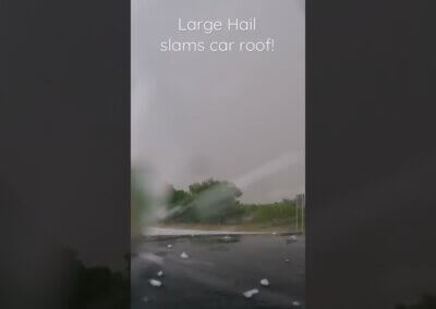 Hail Beats Down on Car Roof